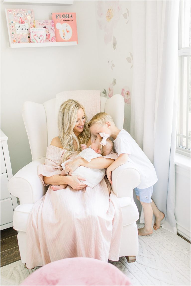  Mom and baby in nursery during a photoshoot in Edmond, OK.