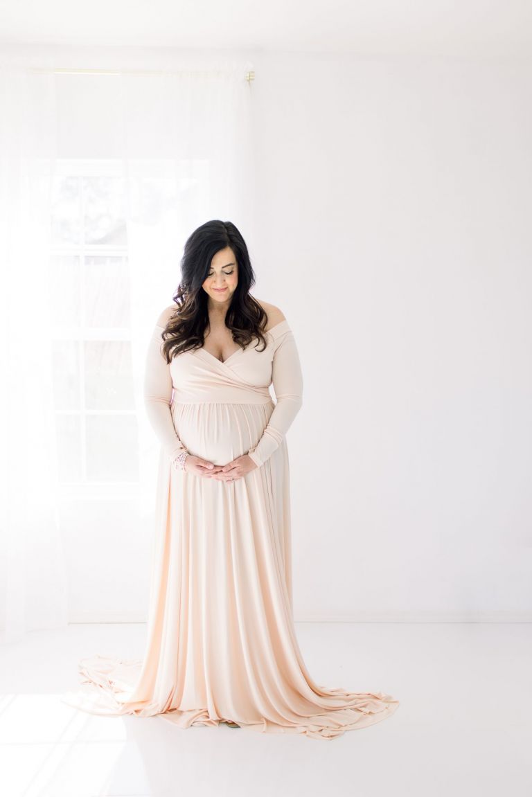 Mother in maternity gown in a studio photo session in okc.