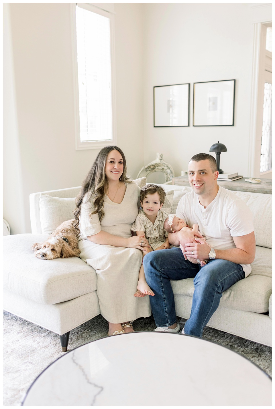 family sitting on couch in living room